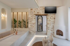 Suite estudio Deluxe, vistas a la ciudad | Zona de estar