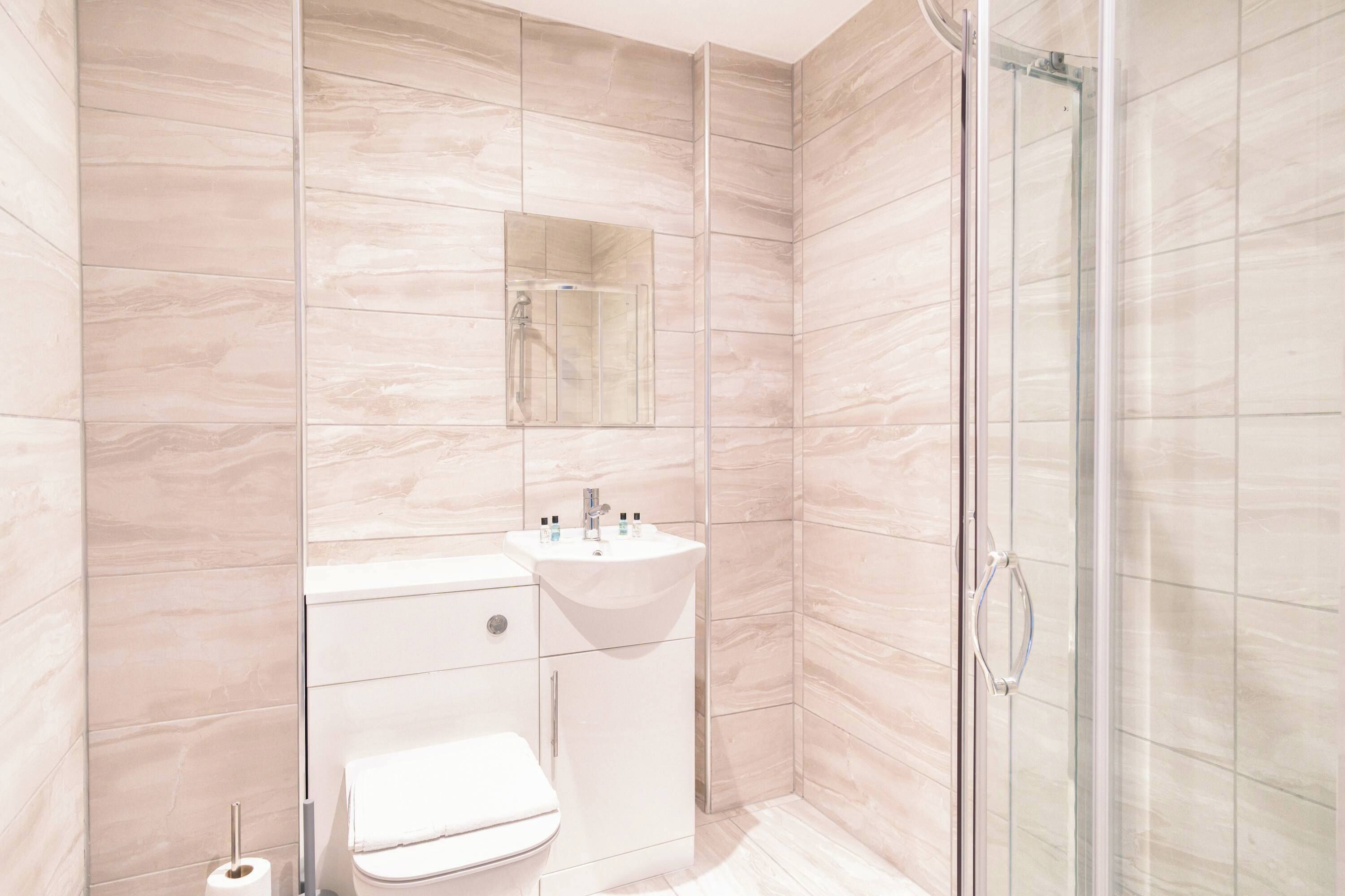 Shower, hair dryer, towels, shampoo