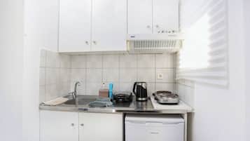 Mini-fridge, stovetop, electric kettle, cookware/dishes/utensils
