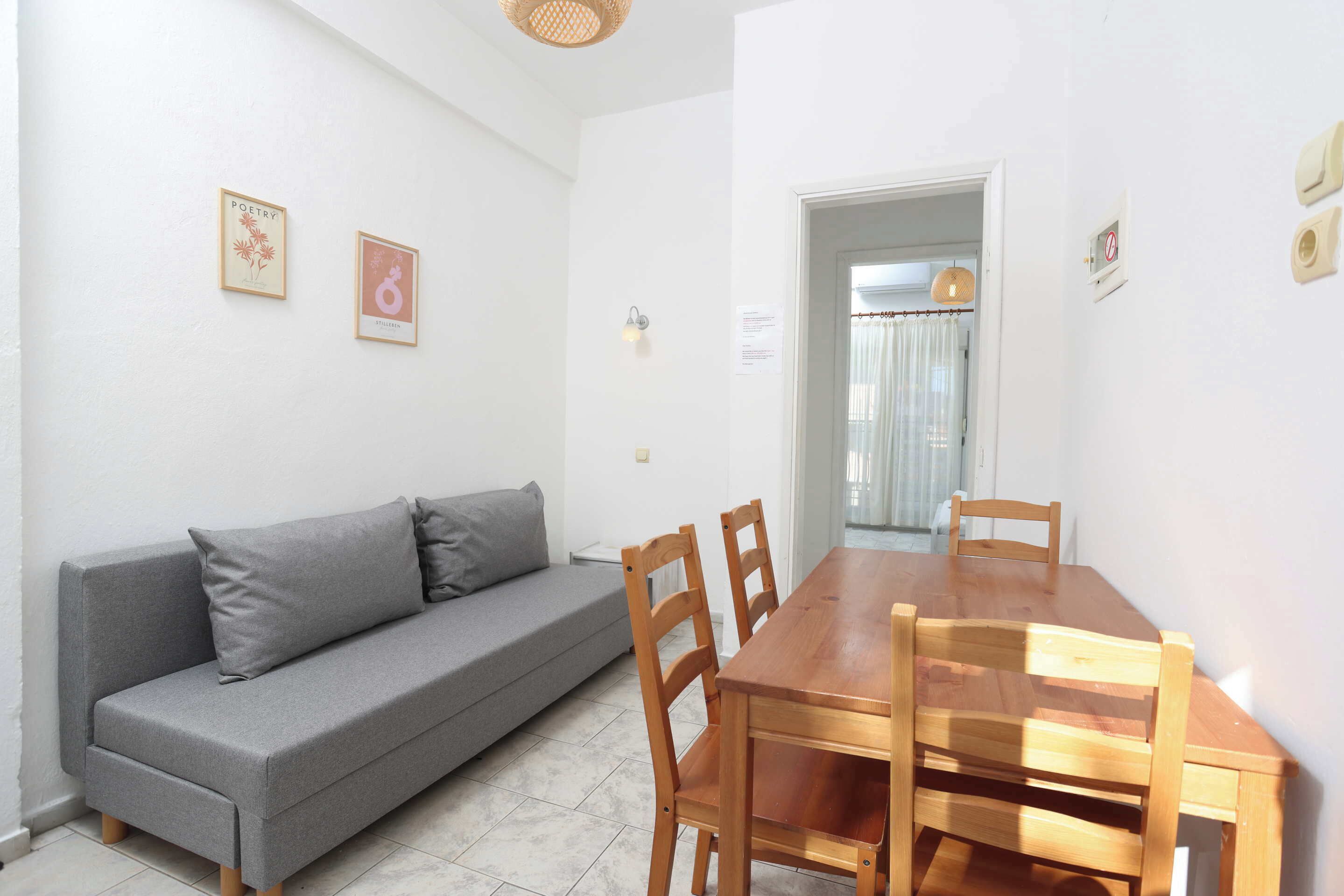 Comfort Apartment | Living area | 50-cm flat-screen TV with digital channels, printers
