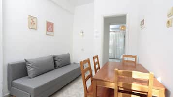 Comfort Apartment | Living area | 50-cm flat-screen TV with digital channels, printers