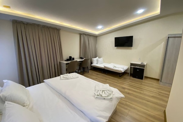 Family Triple Room, City View | In-room safe, blackout drapes, free WiFi