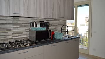 Apartment, Balcony, Ocean View | Private kitchen | Full-sized fridge, oven, stovetop, dishwasher