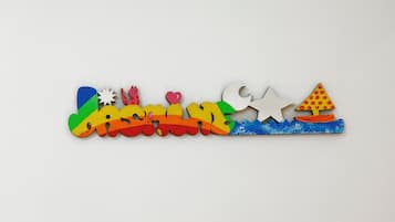A colorful wooden train set with various shapes and figures.