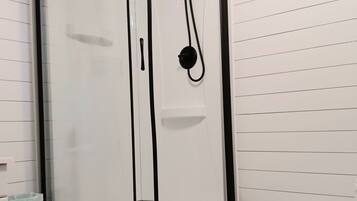 Shower, eco-friendly toiletries, hair dryer, towels