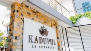 A building entrance with a stone facade and a sign that reads "KADUPUL BY SERENITY". - KADUPUL By Serenity (Negombo)