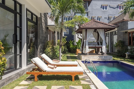 Outdoor pool, open 8:00 AM to 10:00 PM, free cabanas, sun loungers