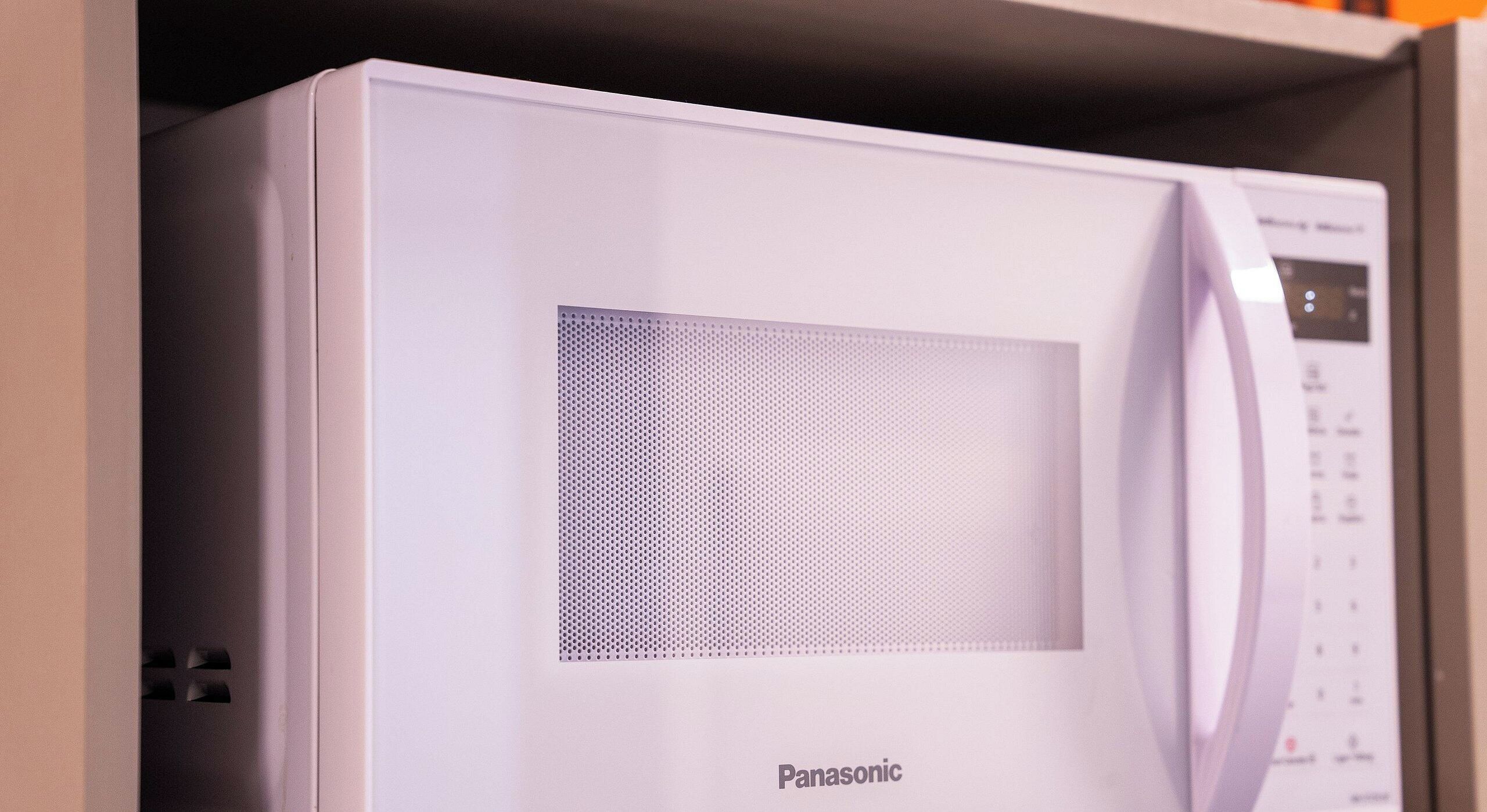 A Panasonic microwave with a digital display and control panel.