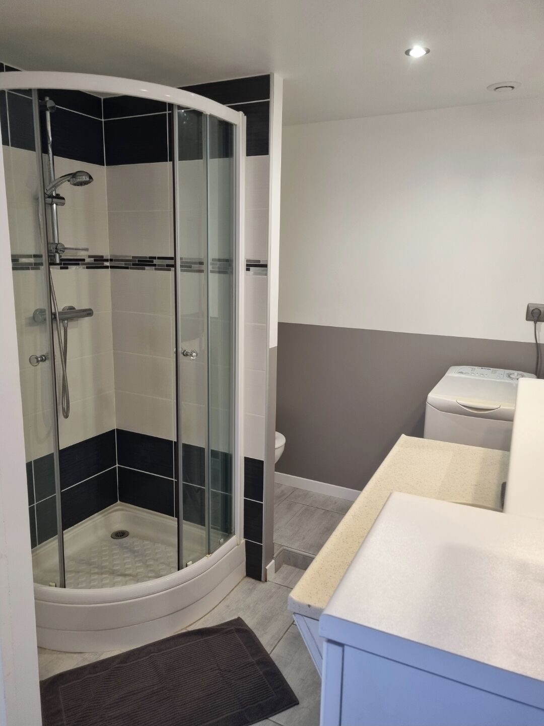 Shower, hair dryer, towels, toilet paper