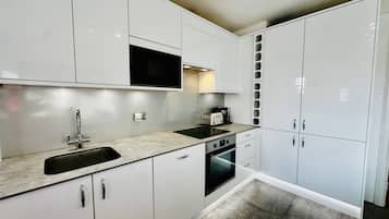 Apartment | Private kitchen | Fridge, microwave, oven, stovetop
