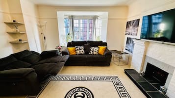 Apartment | Living area | TV, fireplace