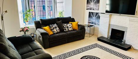 Apartment | Living area | TV, fireplace