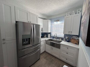 Fridge, microwave, cookware/dishes/utensils