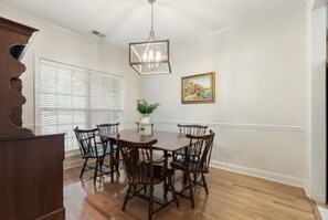 Enjoy meals in this cozy dining area with a round table and six chairs.