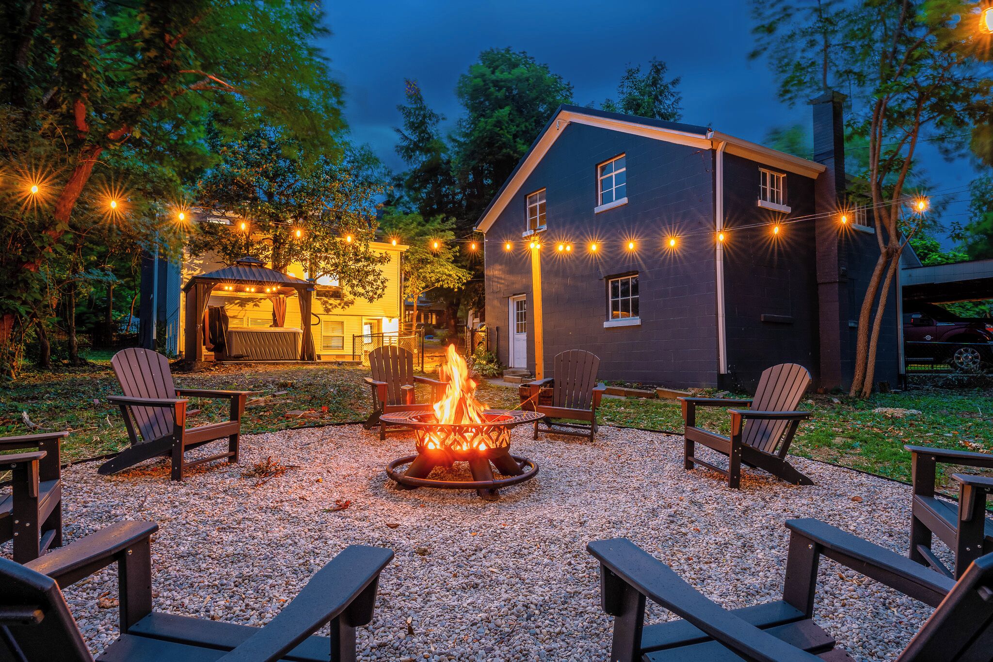 Sip bourbon by the fire under glowing string lights
