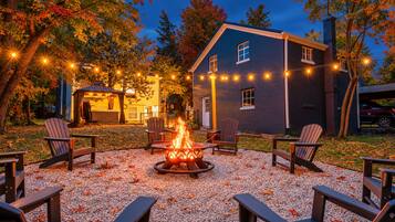 Sip your favorite beverage by the fire under glowing string lights