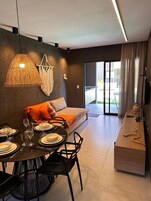 Comfort Apartment, Pool View | Living area | Flat-screen TV