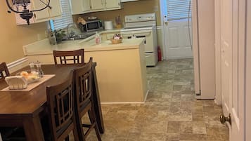 Coffee/tea maker, fridge, microwave, oven