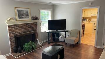 Smart TV, fireplace, DVD player, books