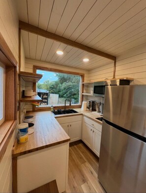 Microwave, stovetop, coffee/tea maker, toaster