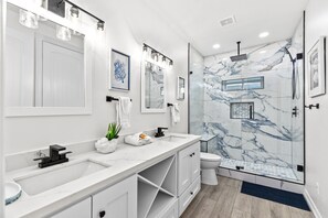 Shower, hair dryer, towels, shampoo