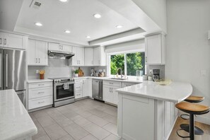 Fridge, microwave, oven, stovetop - Coastal Getaway: 4BR Huntington B near Surf & Sun, 5 minutes to beach (Huntington Beach)