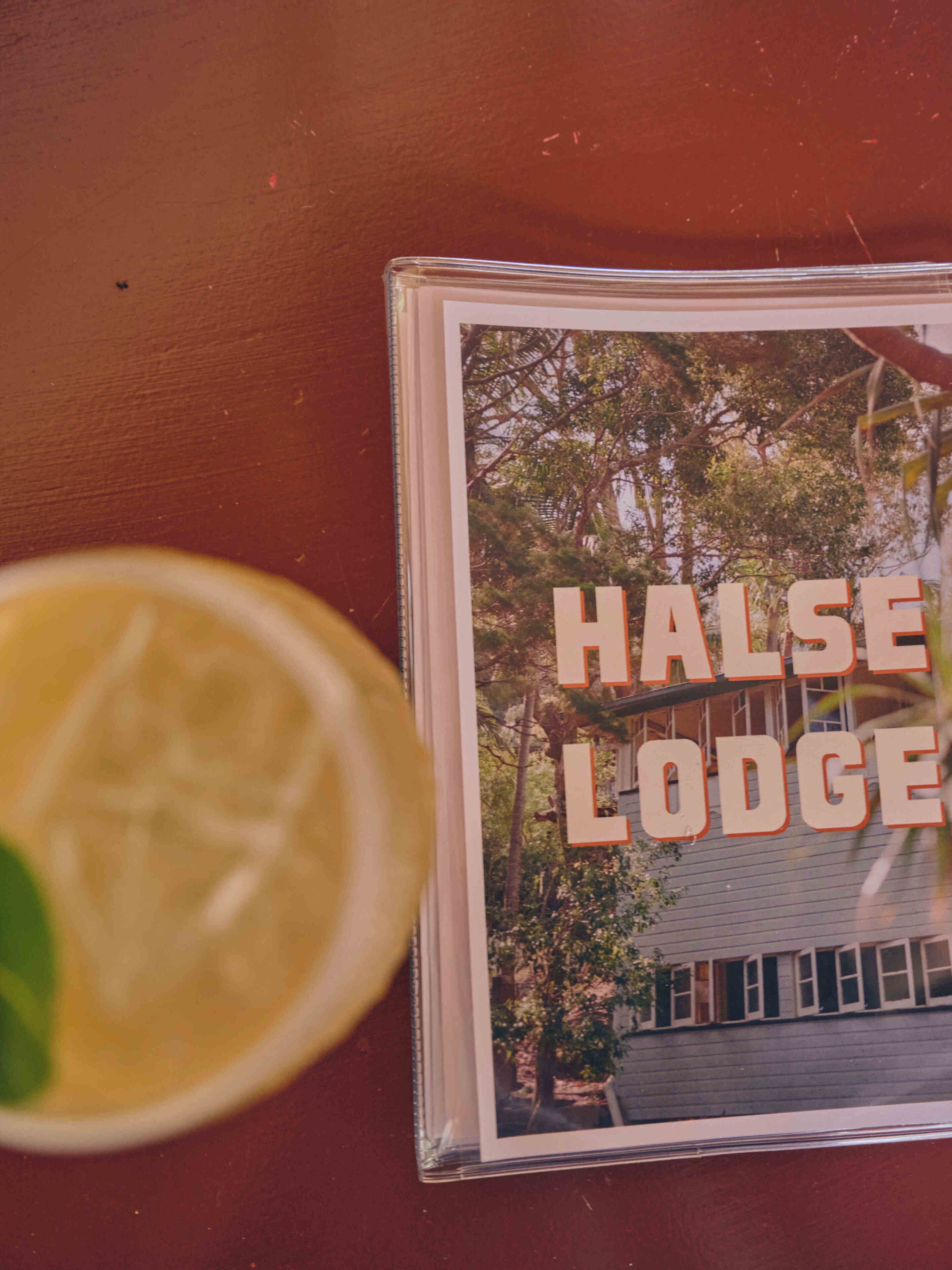 A framed photograph of a building with the text "HALSE LODGE" on it.