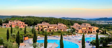 Seasonal outdoor pool, open 9:00 AM to 7:00 PM, pool umbrellas