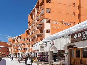 A hotel with multiple balconies and a sign for 'Pierre Vacances L'Aconit'. - 2-Room Apartment, Ski-in/Ski-out, 5 People, Southwest Balcony (Les Menuires)