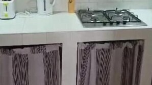 A kitchen with a gas stove, a kettle, and a toaster. - 3 Chambres Salon (Saint Louis)