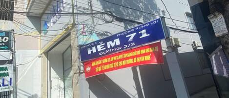 A building with a sign for 'HEM 71' and a partially visible 'NGAN HAN' sign.