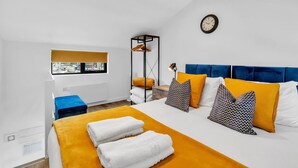 A modern hotel room with a large bed, a window with a view, a bedside table, and a hanging light fixture. - On the Water 5 A One-of-a-Kind Stay | Free Parking | By My Getaways (Brighton)