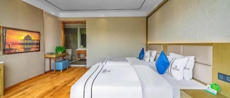 A modern hotel room with a large bed, bedside tables, a desk, and a view of the outside.