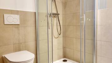 Apartment, 2 Bedrooms | Bathroom | Shower, hair dryer, towels, soap