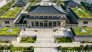A large building with a central courtyard, surrounded by smaller structures with green roofs. - Sunshine Harbor Hotel (Xi'an Sunshine City) (Xi'an)