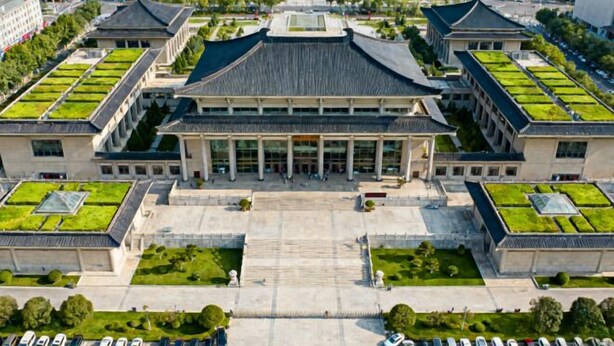 A large building with a central courtyard, surrounded by smaller structures with green roofs. - Sunshine Harbor Hotel (Xi'an Sunshine City) (Xi'an)