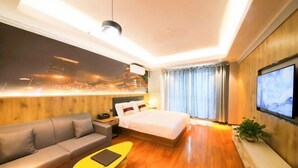 A modern hotel room with a bed, sofa, and a TV. - Sunshine Harbor Hotel (Xi'an Sunshine City) (Xi'an)