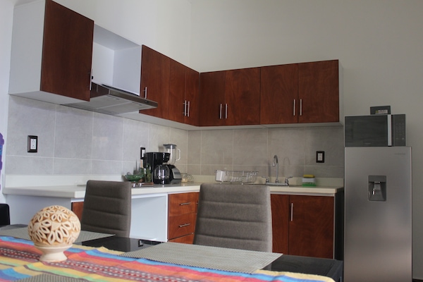 Classic Suite, Multiple Beds | Private kitchen | Fridge, stovetop, coffee/tea maker, cookware/dishes/utensils