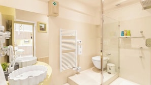 Shower, hair dryer, towels, soap