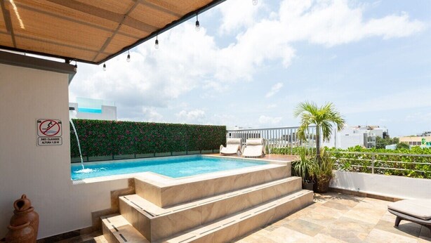 Outdoor pool, open 6:00 AM to midnight, sun loungers