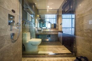 A modern bathroom with a glass-enclosed shower, a toilet, and a sink. - Yuting Hotel (Wenzhou)