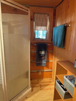 Shower, hair dryer, towels, toilet paper