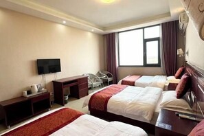 A hotel room with two beds, a desk, a TV, and a window with curtains. - Neixiang Zhengyuan Business Hotel (Neixiang)