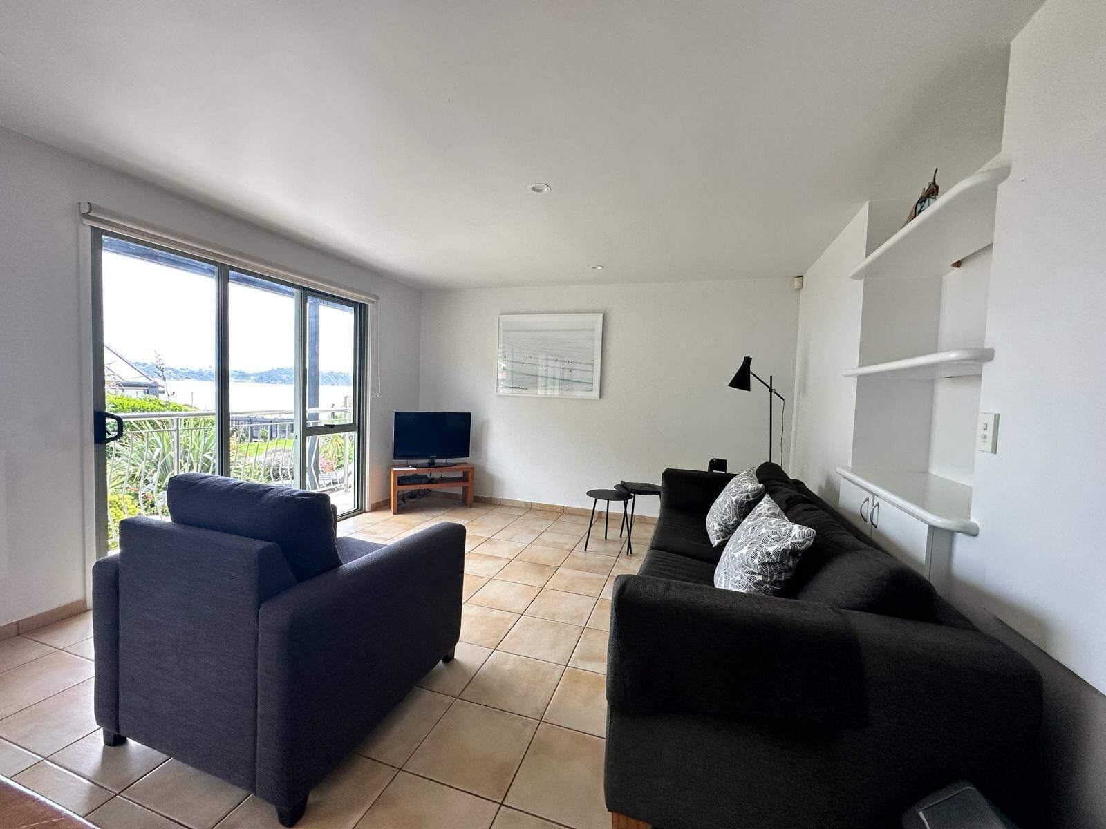 Seaview - Upstairs One Bedroom Apartment | Living area | 32-inch flat-screen TV with satellite channels, TV