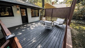 A wooden deck with a white building adjacent to it. - Modern Stay on Green Valley - 2.5 mi to downtown Greensboro (Greensboro)
