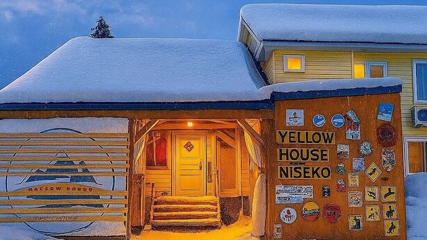 A snow-covered building with a sign reading "Yellow House Niseko". - Yellow House Niseko (Kutchan)