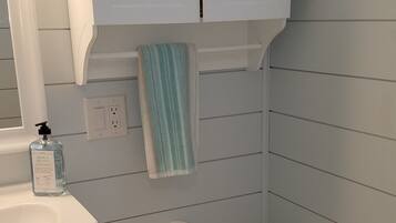 Eco-friendly toiletries, hair dryer, towels, soap