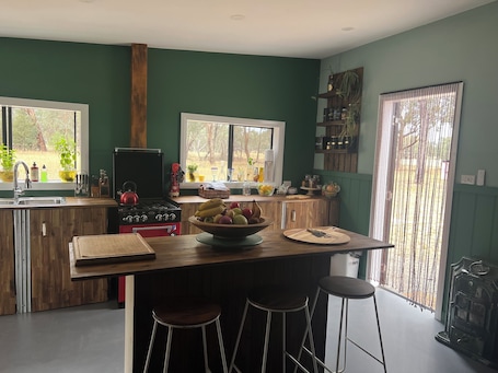 Fridge, stovetop, electric kettle, high chair. The Australian Farm Retreat
