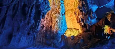 An indoor cave-like environment with a boat ride.