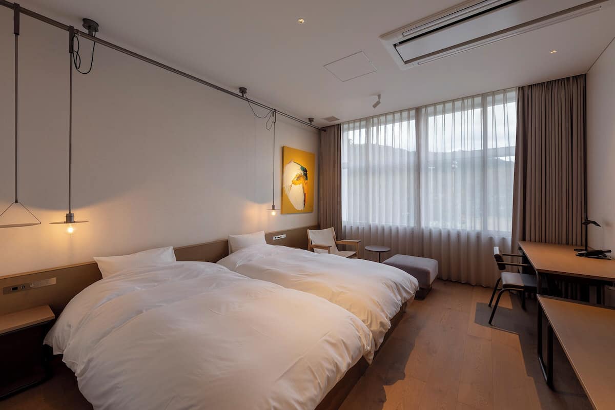 Deluxe Twin Type B, Non Smoking | 1 bedroom, down comforters, in-room safe, individually decorated